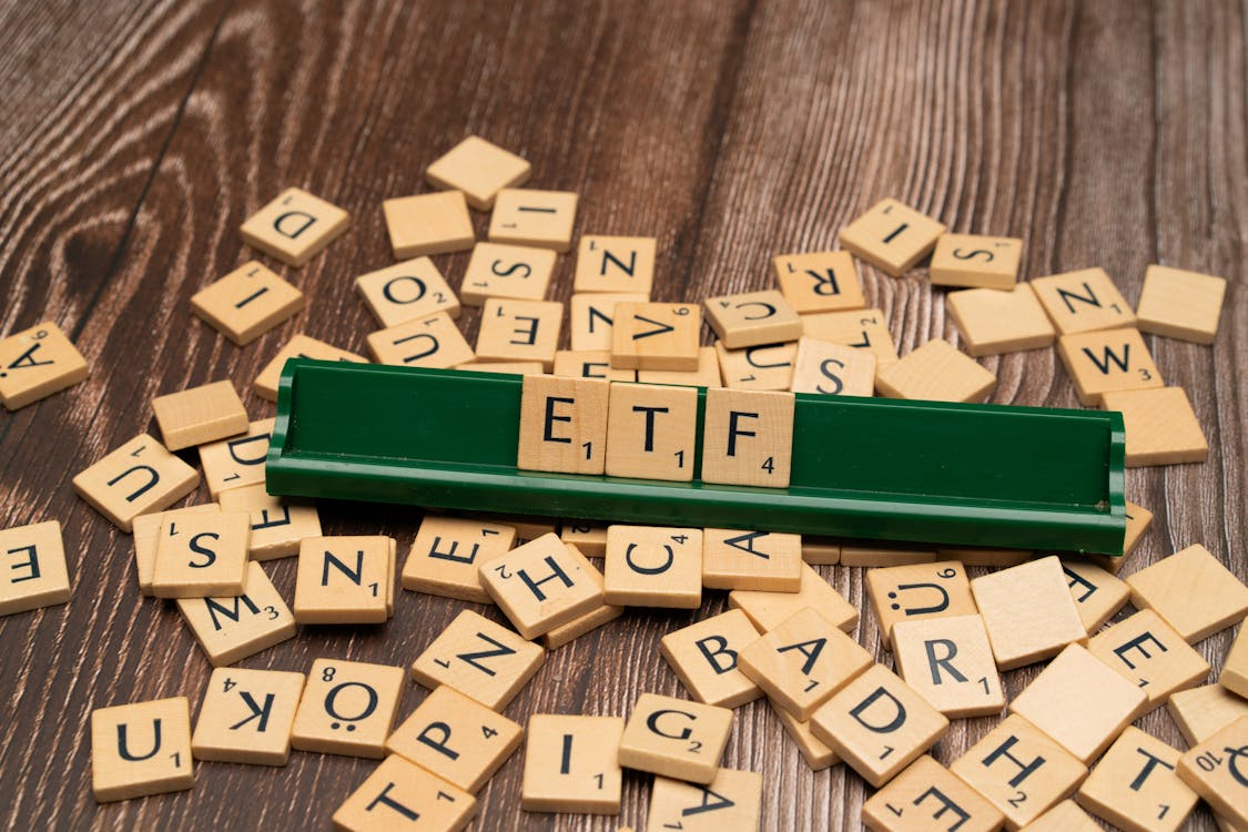 Free The word etf on a wooden board with scrabble tiles Stock Photo